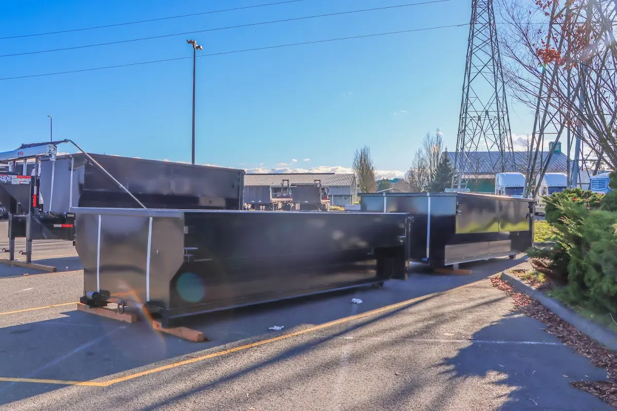 Roll-off dumpster ready for waste disposal at job site for 15 Yard Dumpster Rental in Spring